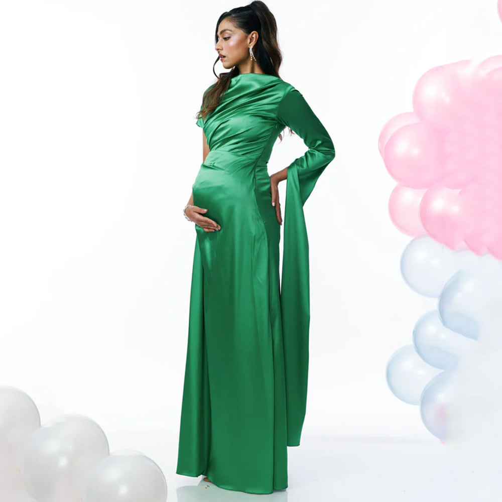 Green maternity dress with ruching and high neckline, perfect for events. Shop online from our curated edit of premium fashion.