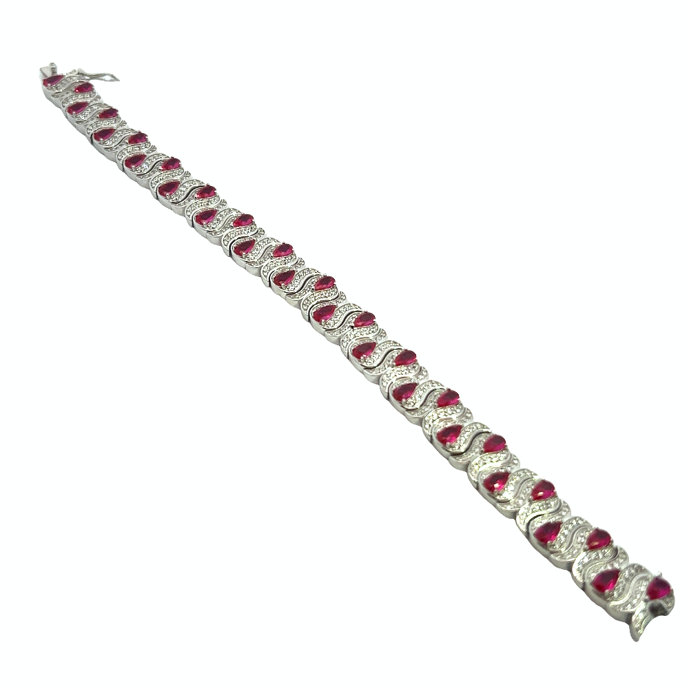 Sterling silver bracelet with lab-created ruby stones and sparkling cubic zirconia for a bold timeless look. Shop premium jewelry online.