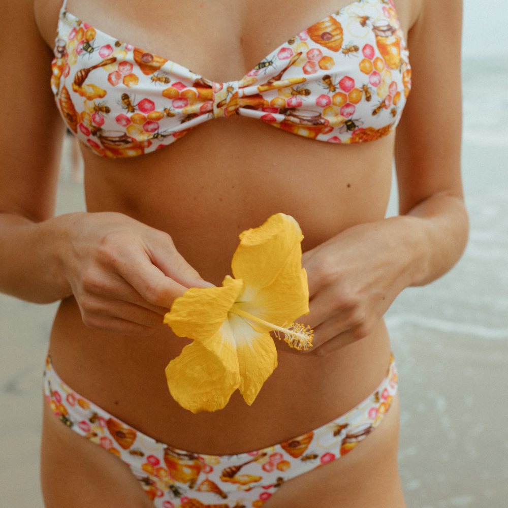 The Terresa Bikini Top exemplifies luxury swimwear, with its halter top style and adjustable back straps.