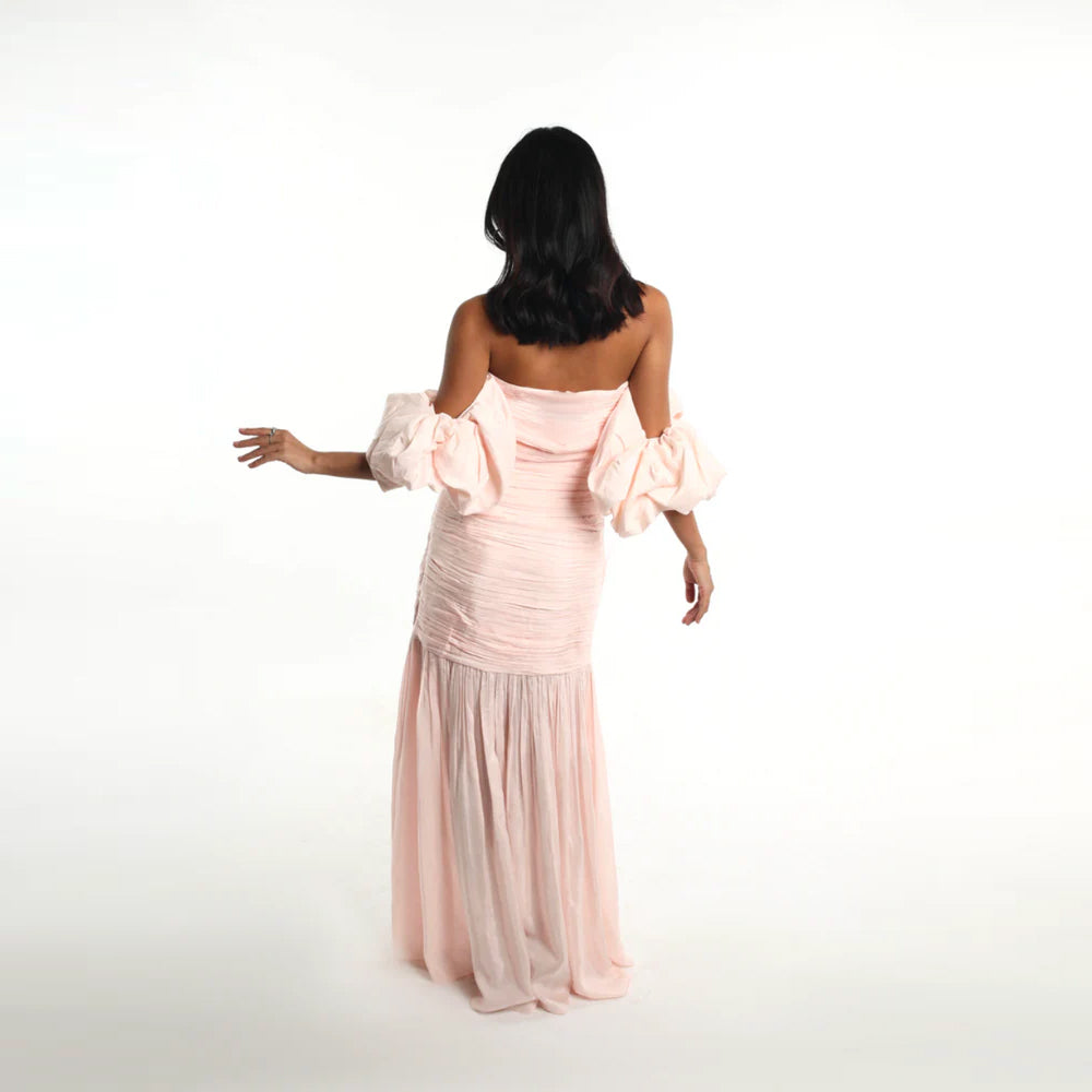 Blush off shoulder dress with puff sleeves and breezy skirt, perfect for parties. Shop online from our curated edit of premium fashion.