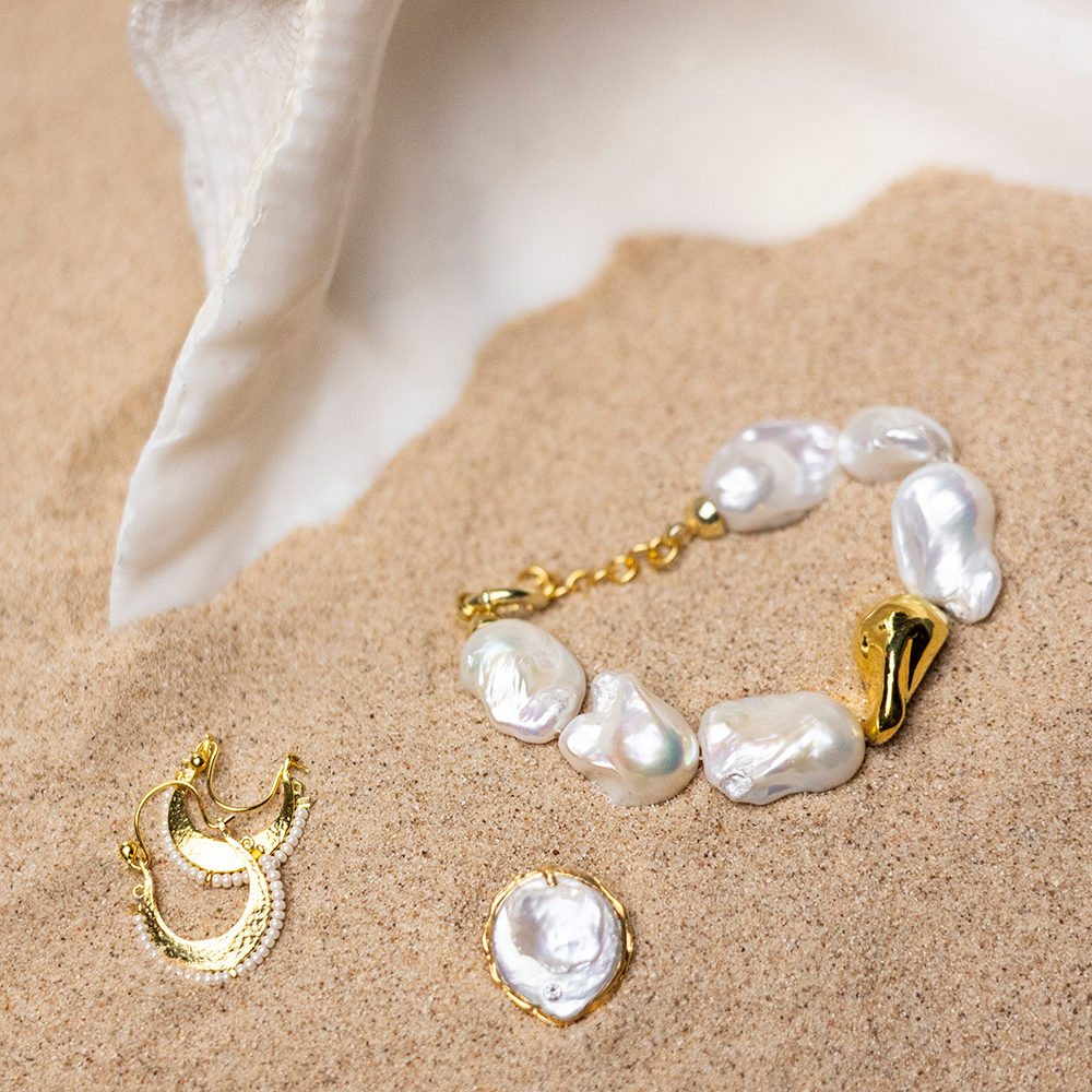 Harmony Pearl Earrings in 22K Gold Vermeil, inspired from Apollo, the god of prophecy & music with natural white pearls. Buy luxury jewellery.Shop now!