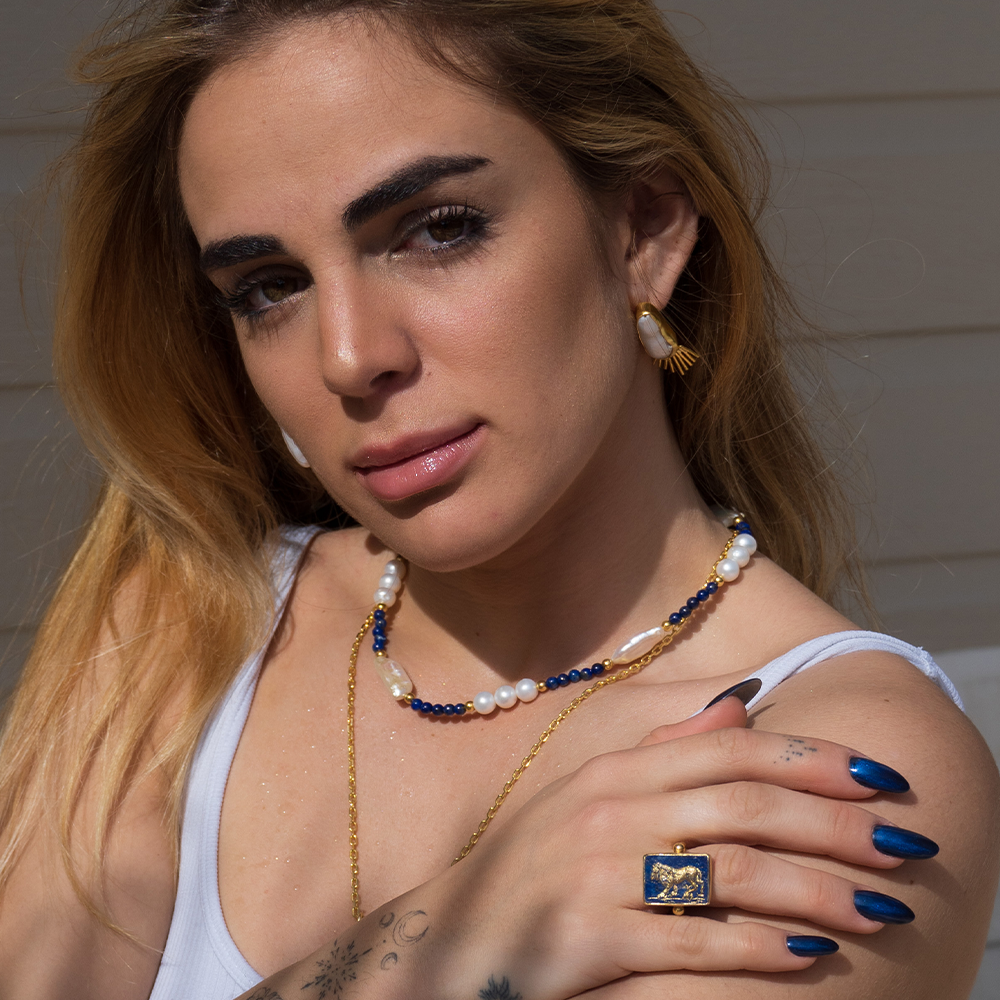 Nemean Lion Ring is hand sculpted with charming 22K Vermeil Gold & astonishing Lapis-Lazuli gemstone. Get exclusive accessories for women. Shop now!