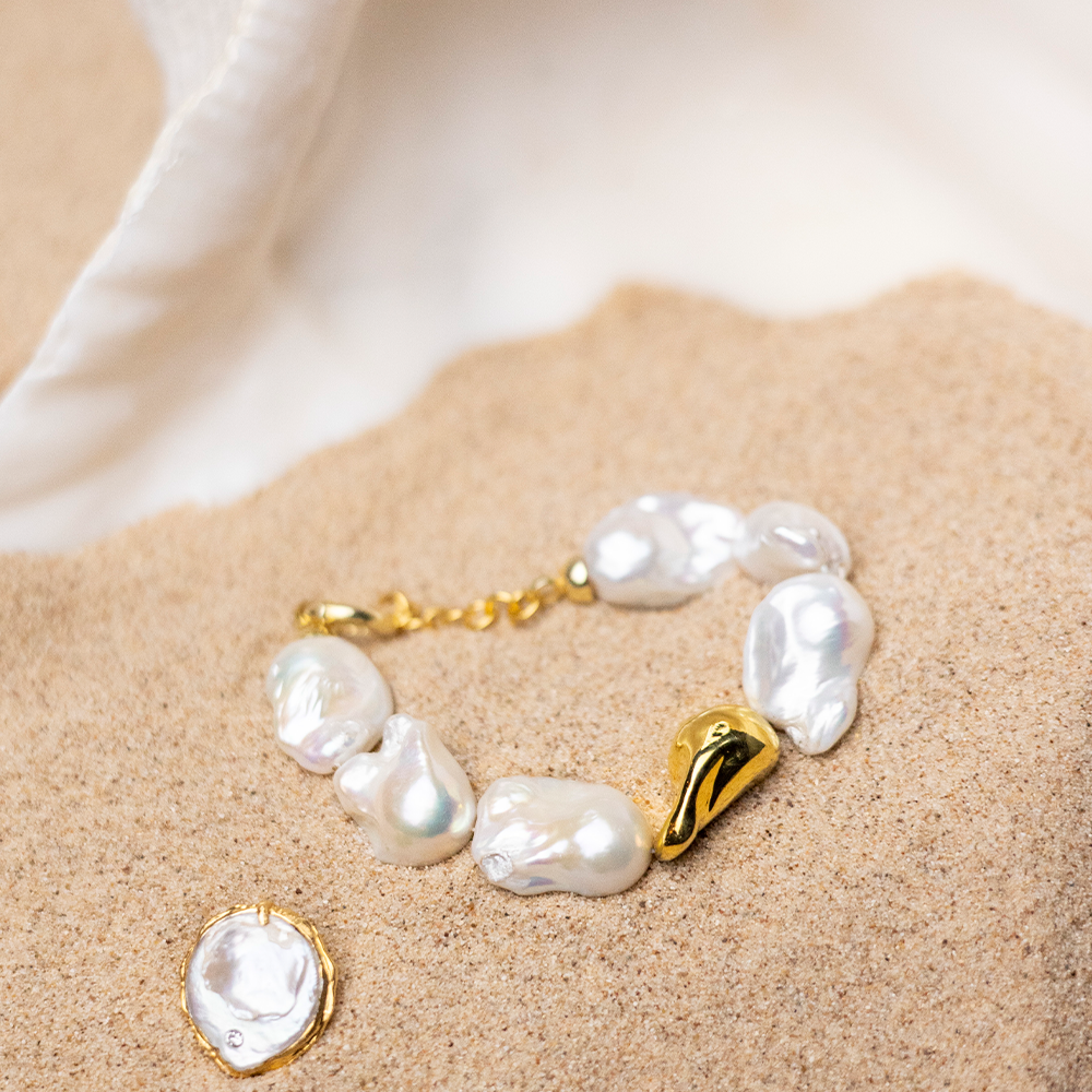 Embrace divine imperfection with our Baroque Pearl bracelet, featuring a unique 22K Gold Vermeil Pearl. Shop designer accessories. Shop now!