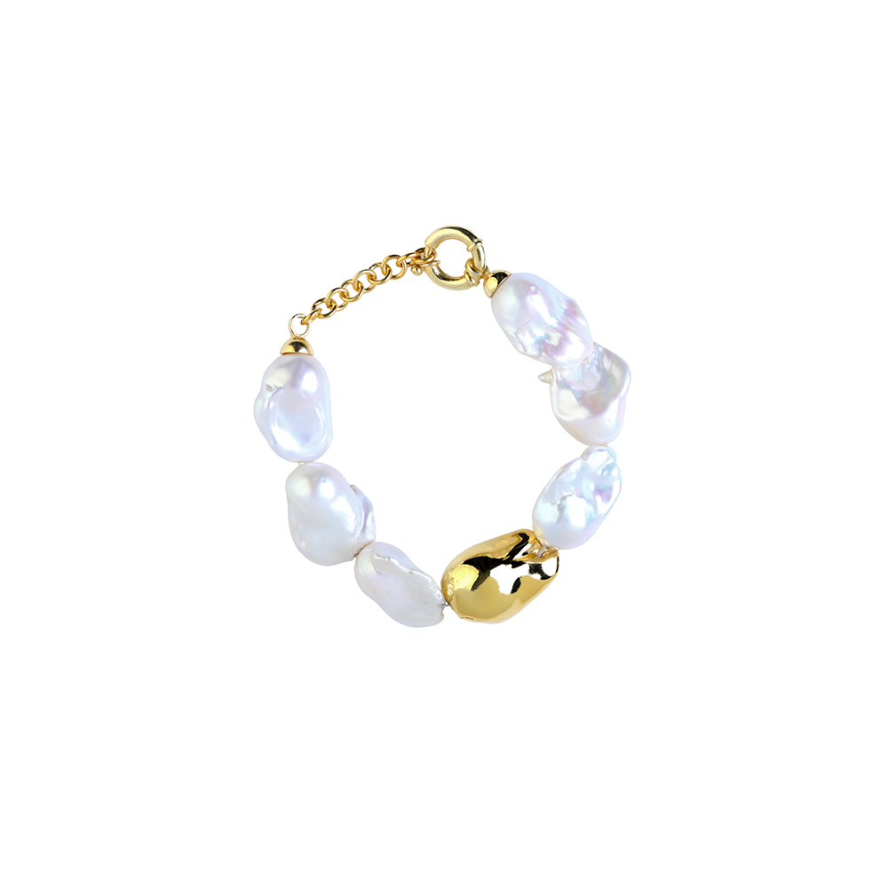 Embrace divine imperfection with our Baroque Pearl bracelet, featuring a unique 22K Gold Vermeil Pearl. Shop designer accessories. Shop now!