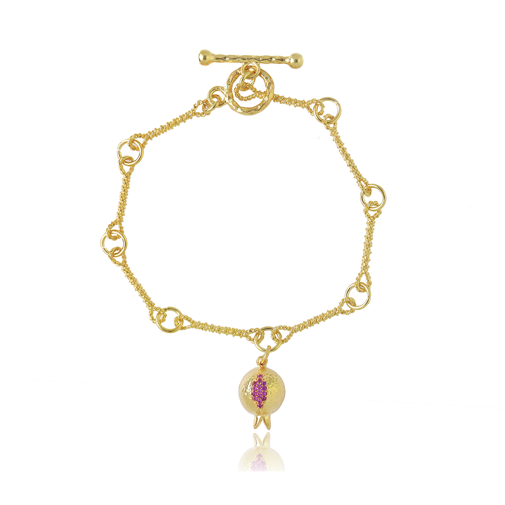 The Pomona Bracelet is inspired by historical gold manufacturing technique. Adorned with red garnet, from our curation of women's jewellery. Shop now!