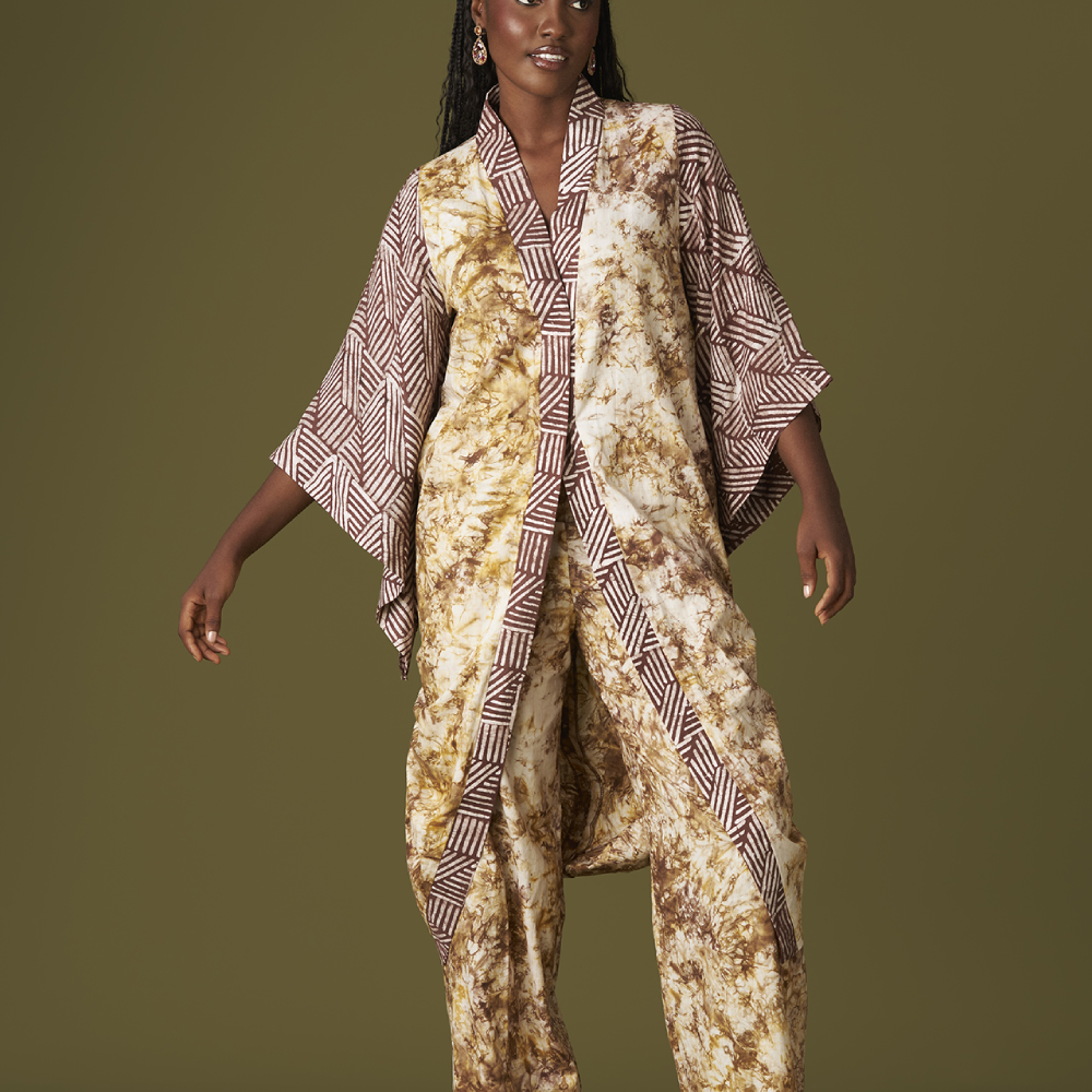 Crafted from hand dyed batik,the Kwelaku exclusive Uzoma kimonowith contrasting print triples as a kimono,wrap dress.