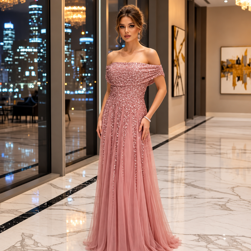Shop online from our exclusive website. Discover the Tiffany pale pink maxi gown featuring sequin fabric, an off-the-shoulder neckline, short sleeves, and a flattering silhouette for weddings, galas, and special occasions.
