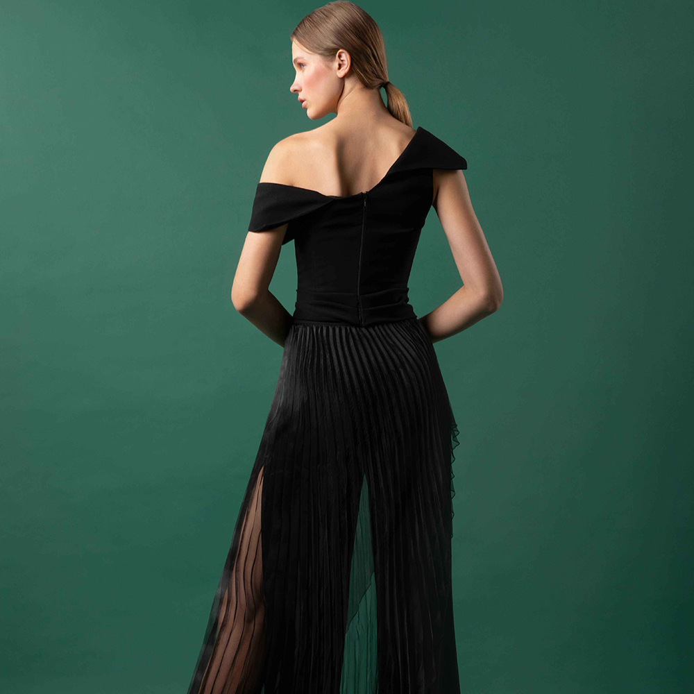 Asymmetrical cross over crepe top with stitched belt drapery paired with wide leg crepe pants.