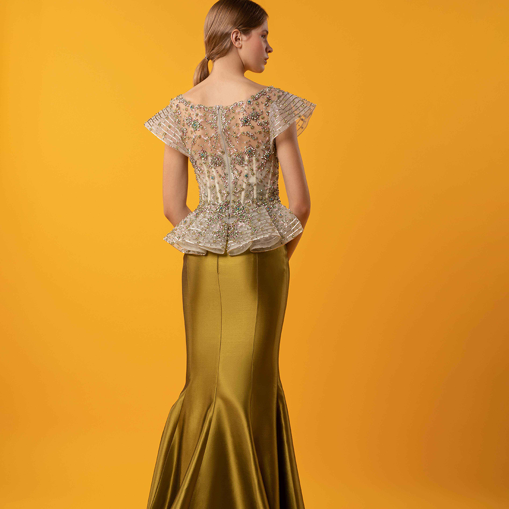 Bejeweled top with draping on the back waist, and a high waist mikado mermaid skirt.