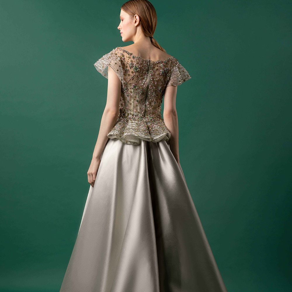 Bejeweled top with draping on the back waist, and a high waist mikado mermaid skirt.