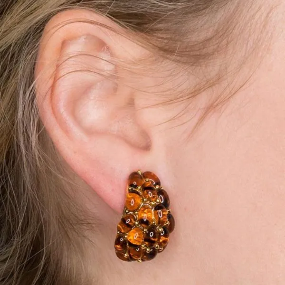 Gold and tortoise cabochons in a half hoop silhouette add a touch of glam to any look.