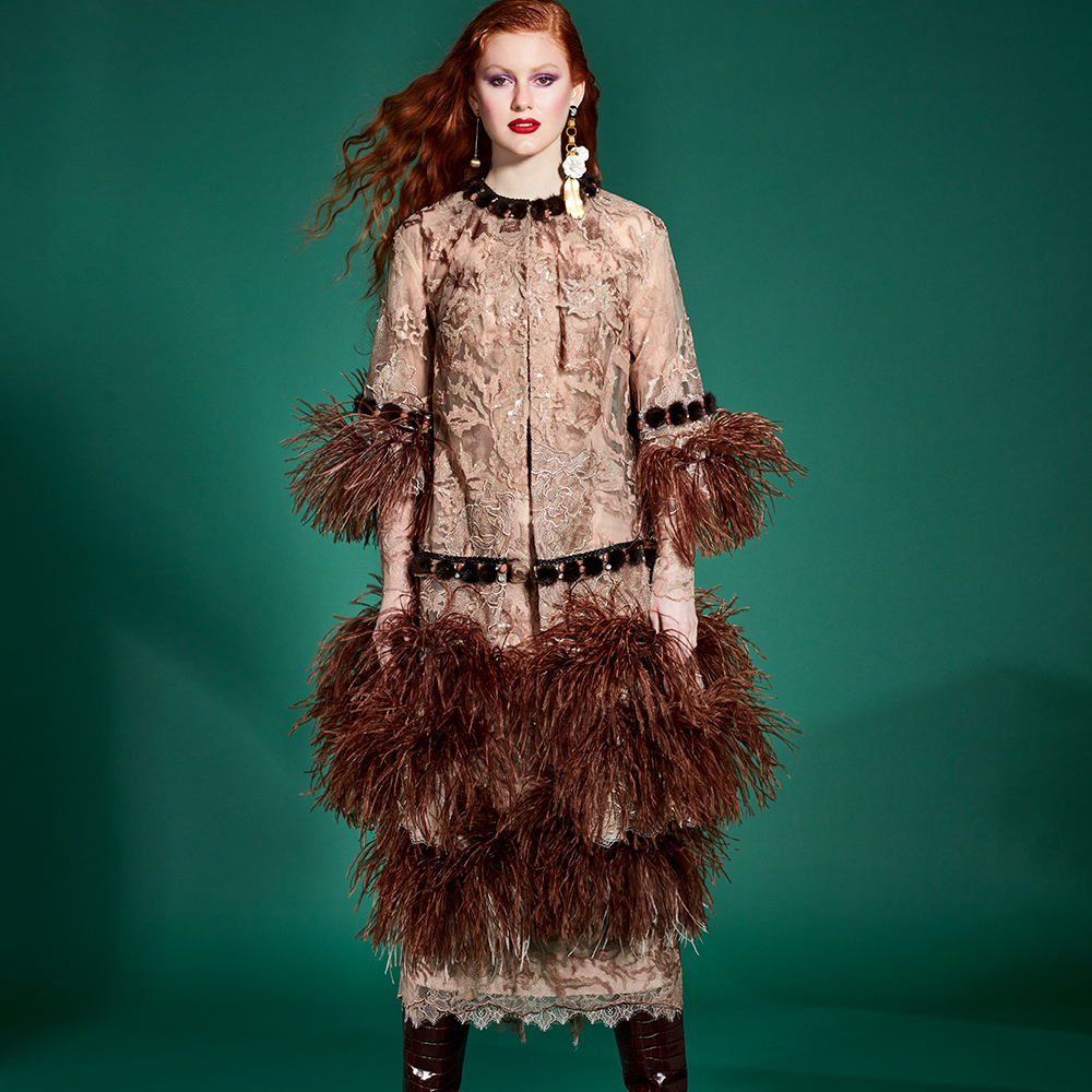 In this outfit, dress and coat are decorated with brown ostrich feathers, as well as the sleeves of the coat.