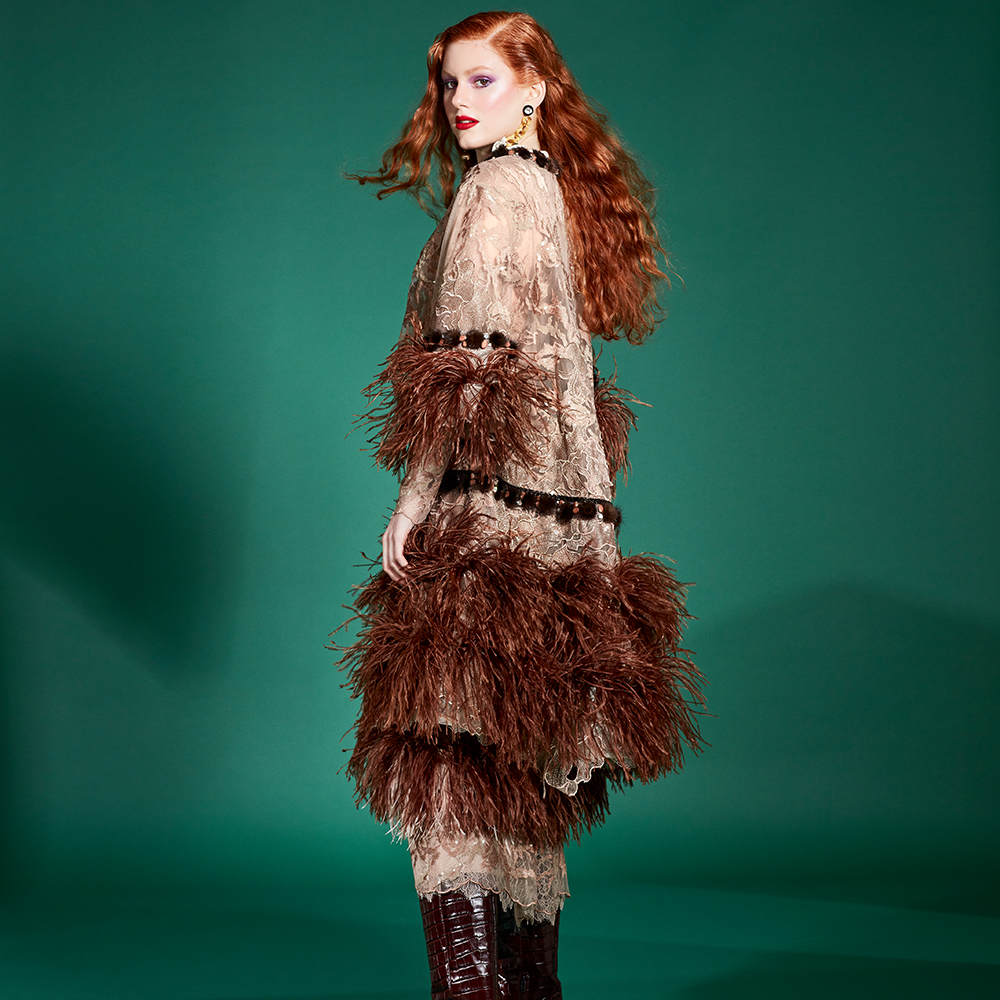 In this outfit, dress and coat are decorated with brown ostrich feathers, as well as the sleeves of the coat.