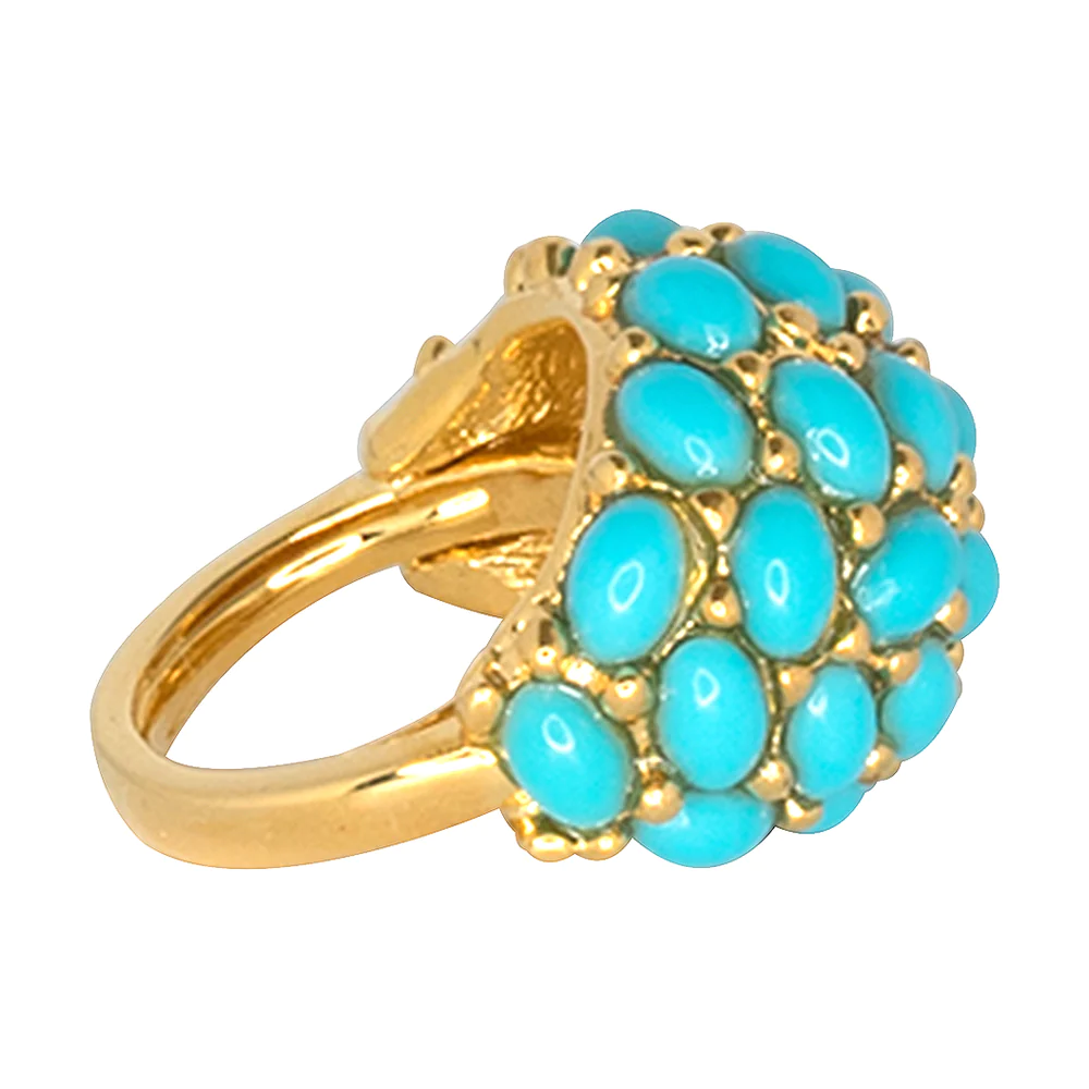 Turquoise cabochons flanked this gold dome shaped ring to brighten up any hand.