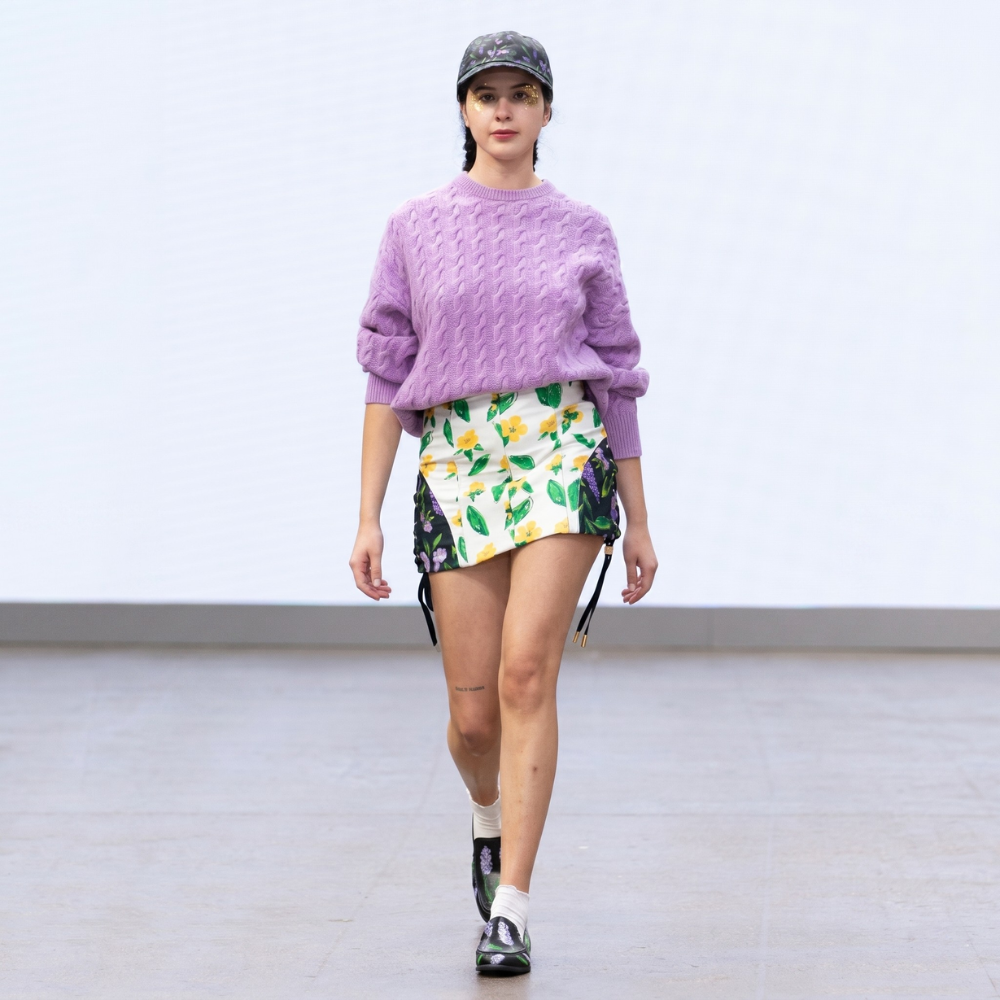 Black cap with purple pansy and lavender print, adjustable fit. Shop premium styles online.
