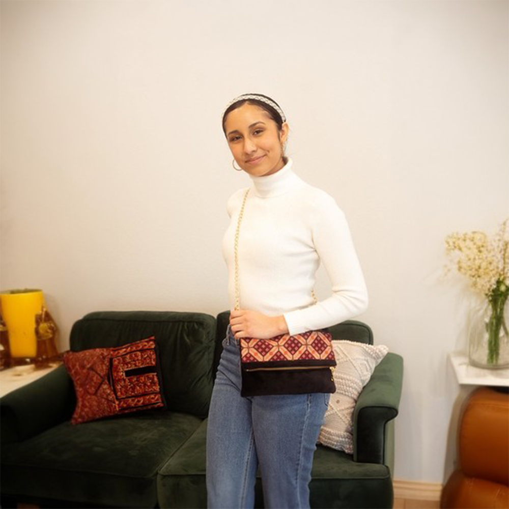 Our tatreez crossbody bag is hand-embroidered with a traditional Palestinian tatreez design.