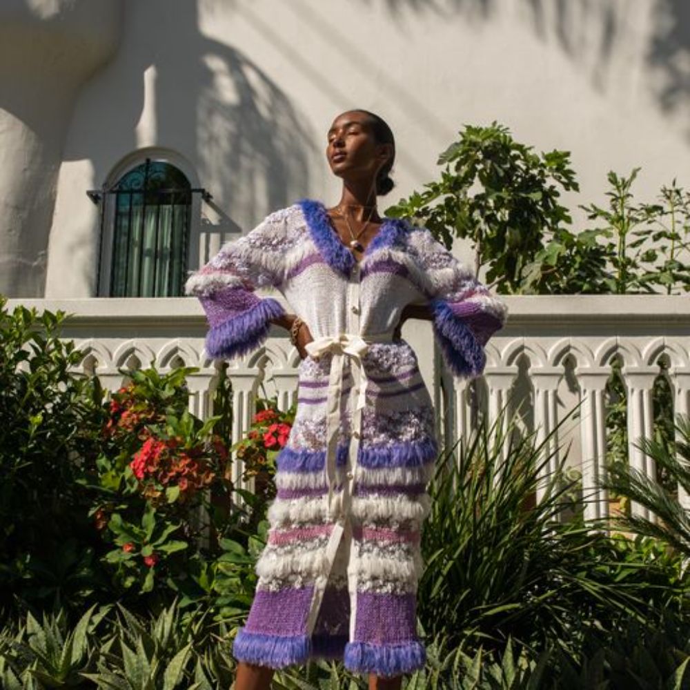 Violet Multicolor Knit Cardigan-Dress With Pearl Buttons is spun from a soft silk blend.