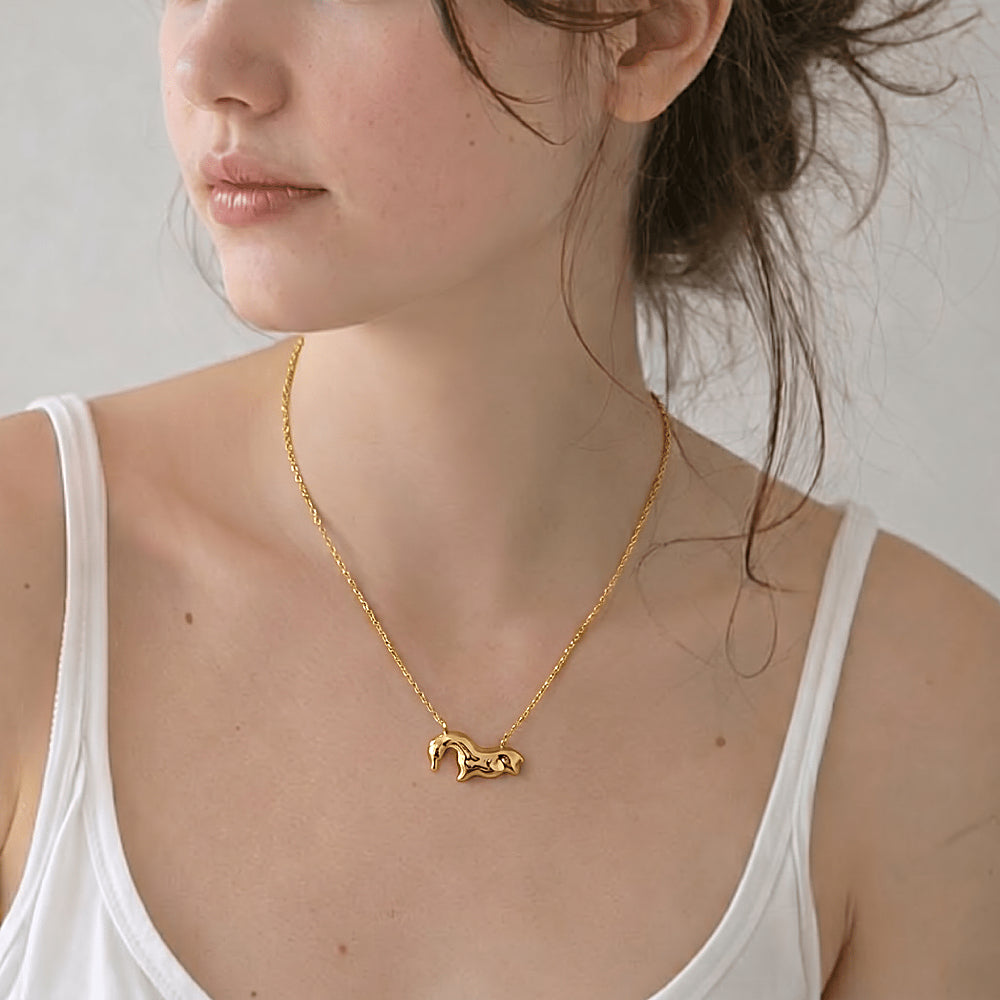 Discover the Vogelherd Horse Gold Vermeil Necklace at The Luxe Maison, featuring a timeless horse pendant inspired by 40,000-year-old prehistoric art.