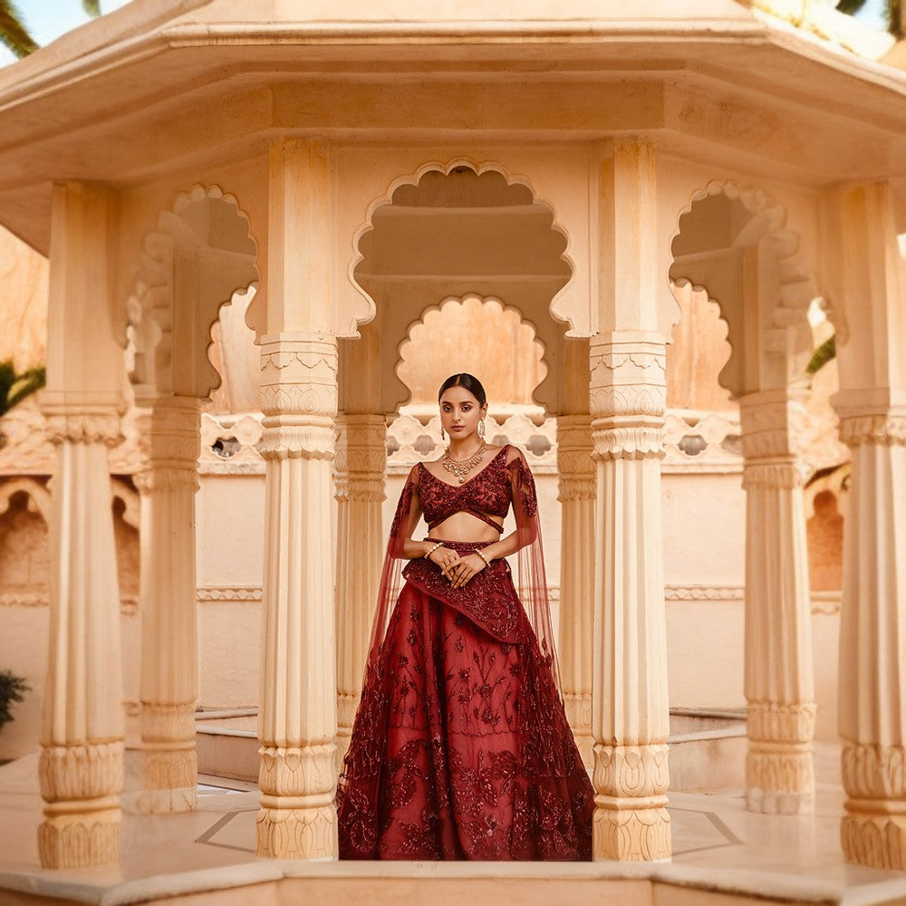 Signature Water lily and birds motifs in Signature Brushstroke embroidery in blouse, dupatta sleeves and lehenga.