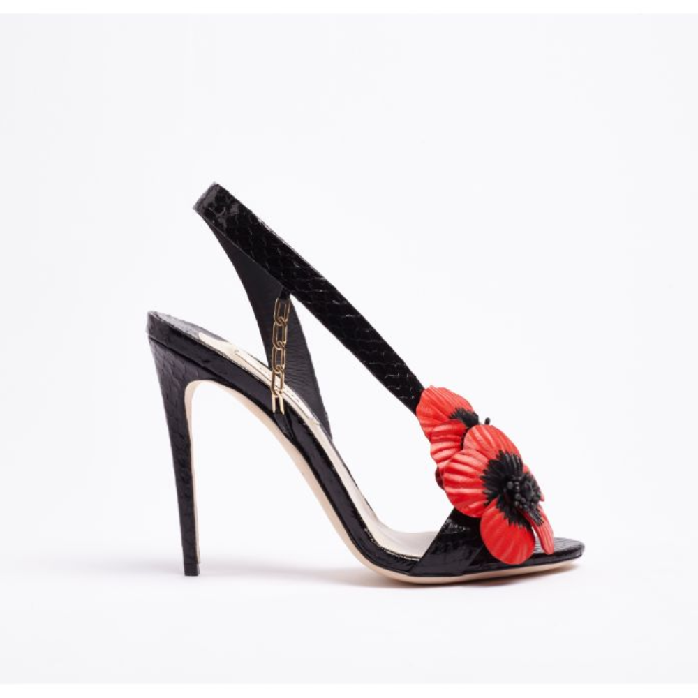 L’Amazone Coquelicot is a high-heel sandal designed in black watersnake for a luxurious look. 