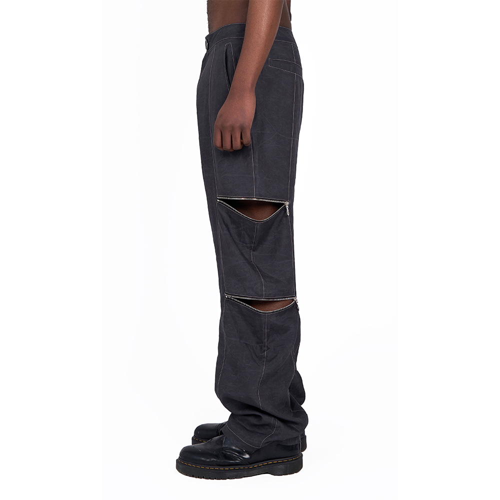 Find the perfect designer trousers with zip openings in premium waxed Tencel. Shop Now!