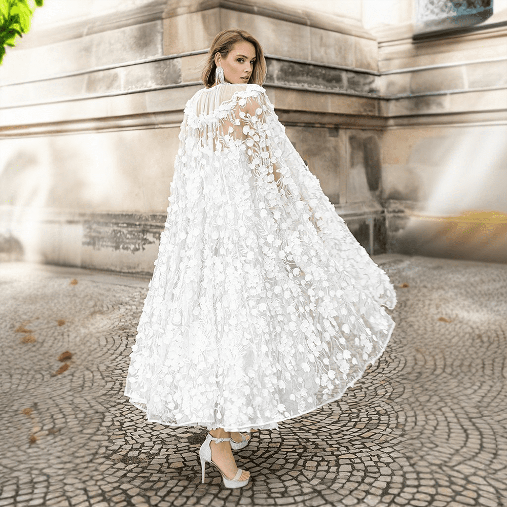 The floral detailing coupled with off-shoulder sheer sleeves will leave you feeling like the belle of the ball. 