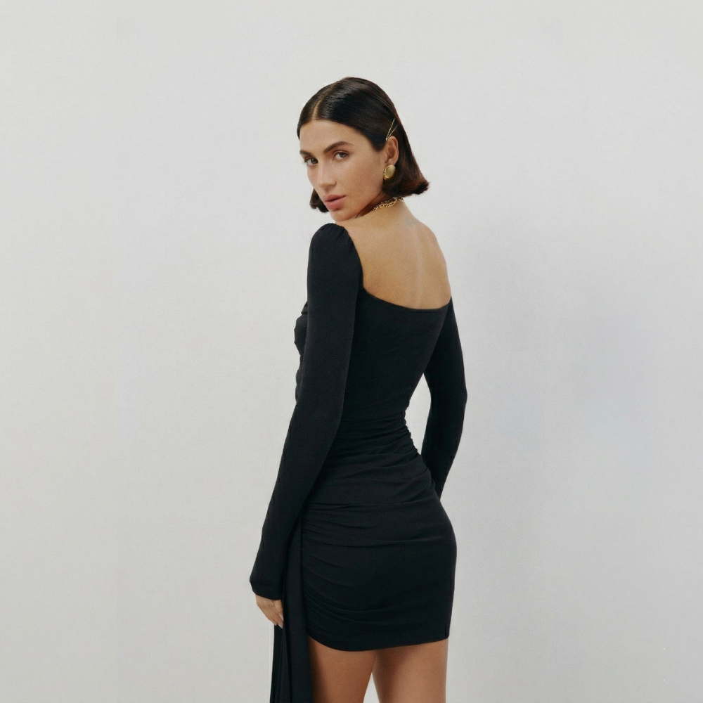 Perfectly fitted knit dress with a gold chain detail and elegant leg-length train. Shop now at our exclusive clothing website.