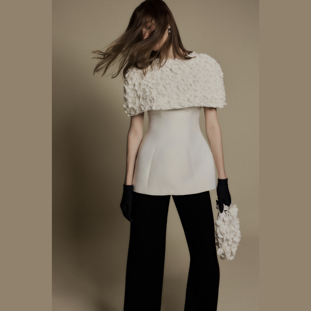 Discover chic designer women's clothing featuring the sophisticated White Bloom 3D Floral Cape. Shop Now!