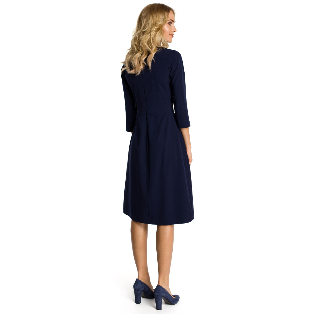 Woven fabric; fit and flare cut; below knee length; front pleats below the waist band; three-quarter sleeves.