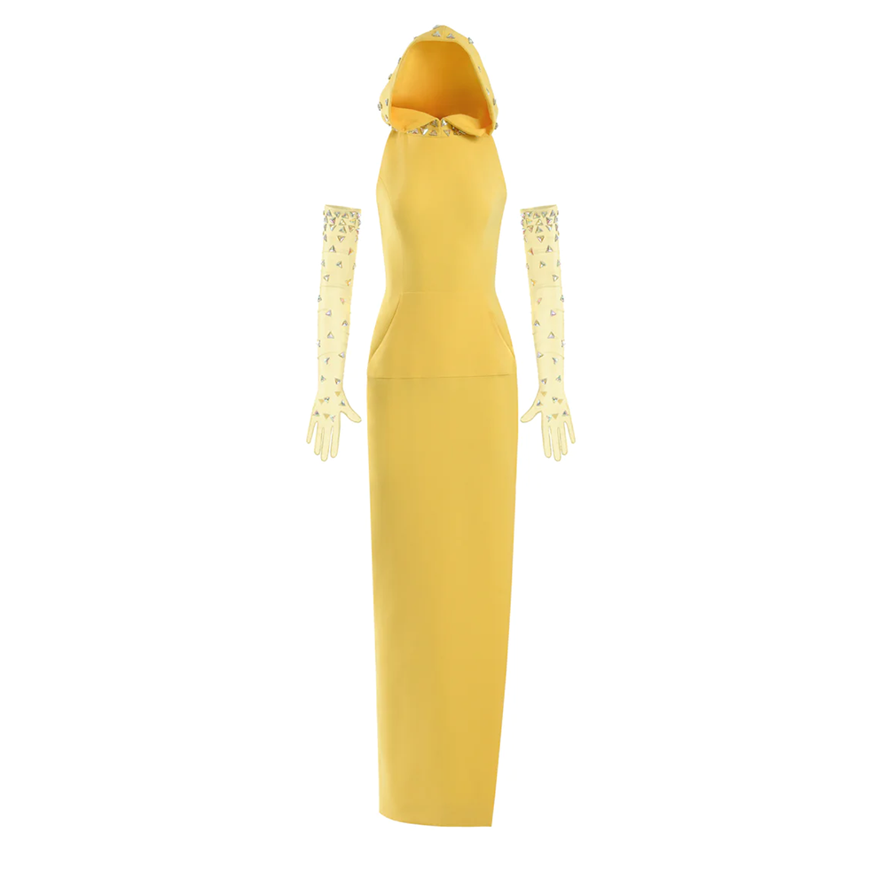 A yellow crepe hoodie dress with a thigh-high side slit. Worn with embroidered tulle gloves.