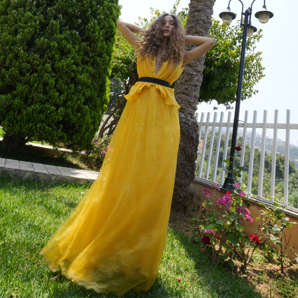 Yellow pleated organza dress with lace skirt.