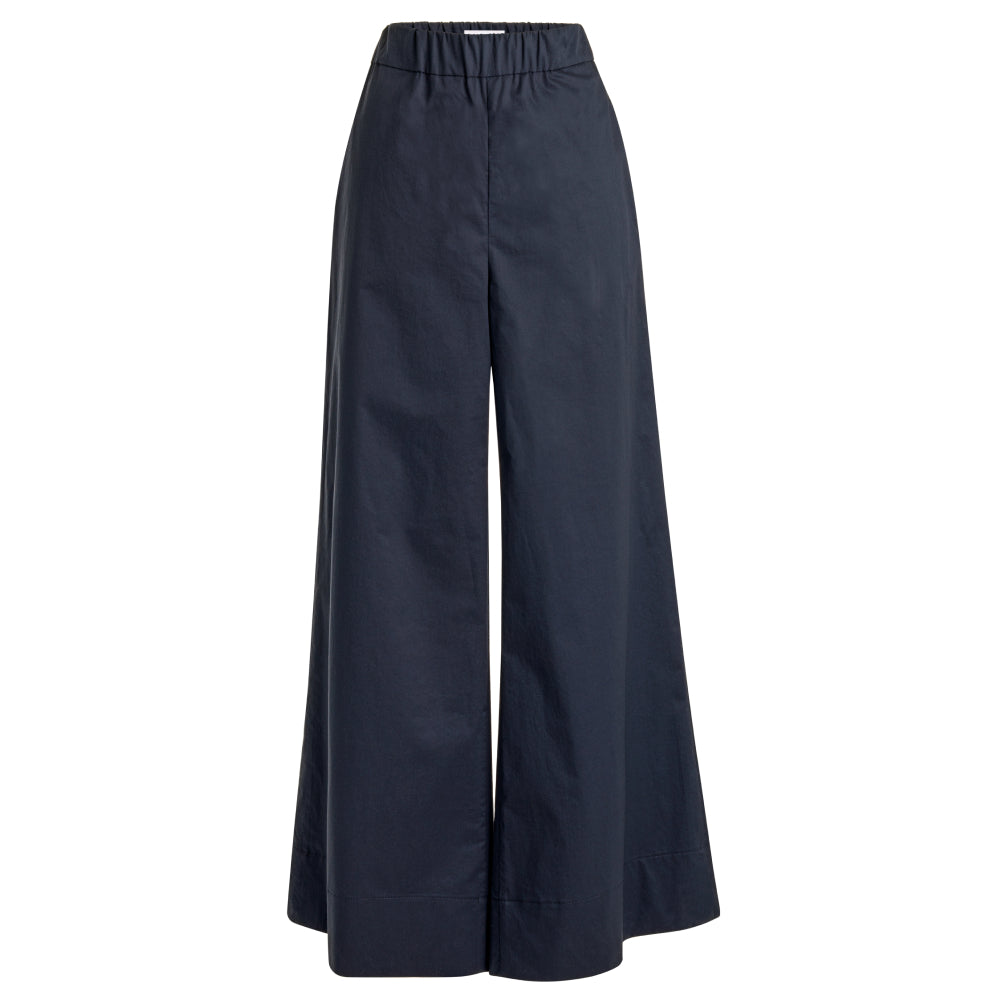 Discover the Zen Pants at The Luxe Maison, featuring a wide palazzo silhouette, elastic waistband, and side pockets for effortless comfort and versatile styling.