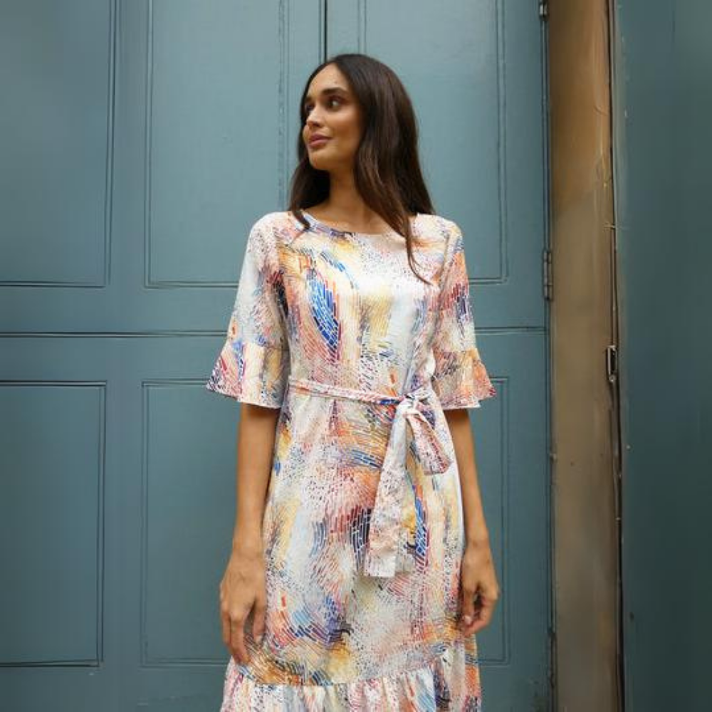This beautiful multi print dress features a detachable tie belt around the waist and mid length sleeves