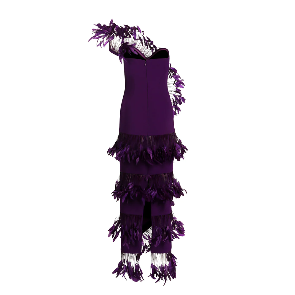 An asymmetric dress in purple silk crepe and ruffled plumes.
